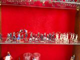 many figurines that are on the shelves in the room