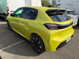 a yellow car that is parked in a parking lot