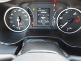 a close up of a car dashboard with a speedometer and gauges