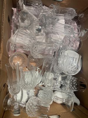 a lot of glassware in a box on the table