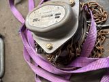 a purple leash with a chain attached to it on the ground