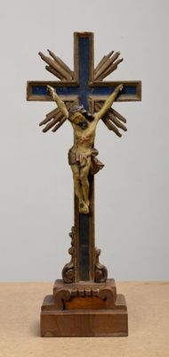 a statue of jesus on a cross on a table