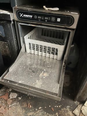 a dirty dishwasher inside of a dirty oven