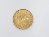 a close up of a gold coin with a man ' s face on it