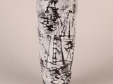 a black and white picture of a vase on a table