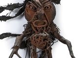 a sculpture of a man made out of wood and wire