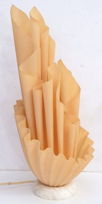 a vase that has a bunch of paper flowers in it