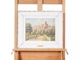 an image of a painting on a easel with a picture of a castle in the background
