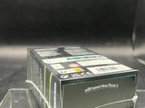 a box of cigarettes sitting on a table next to a glass of water