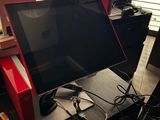 a desk with a laptop and a monitor on top of it