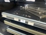 many empty shelves in a store with signs on them