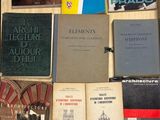 several books are sitting on a table next to each other