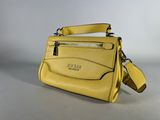 a yellow handbag with a zipper on the front and shoulder strap