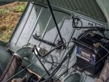 a small engine in the back of a green car