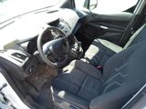 dashboard of a car with a dog sitting in the passenger seat