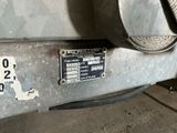 a close up of a car ' s bumper with a number plate on it
