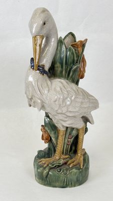 a bird that is sitting on top of a plant