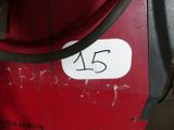 a picture of a red machine with a number on it