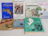 many books that are sitting on a table