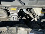 a picture of a car engine with its hood open