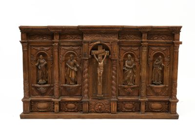 carved wooden crucifix with four figures and a crucifix on the cross