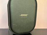 the bose bluetooth headphones are sitting on a black table