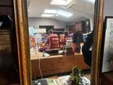 a mirror that is sitting on top of a desk