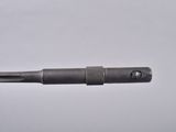 a close up of a pen with a metal handle on a white surface