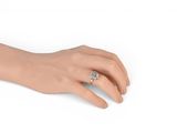 an image of a woman ' s hand with a diamond ring on it