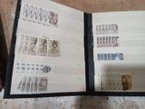 an open book with stamps on it sitting on a table