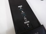 a close up of a remote control on a table