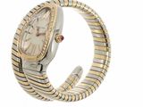an image of a woman ' s wrist watch with a gold and silver bracelet