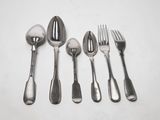 five spoons, two forks, and a spoon on a table