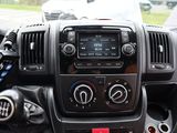 a dashboard of a car with a radio and a steering wheel