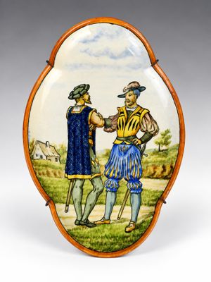 une photo d'une assiette décorative sur laquelle sont représentés un homme et une femme