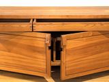 a wooden cabinet with two doors open on a hard wood floor
