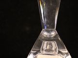a clear glass vase with a small piece of paper in it
