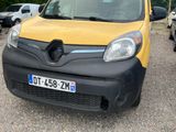 a yellow and black van parked in a parking lot