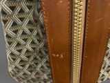 a close up of a purse with a zipper open