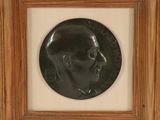 a close up of a framed picture of a man ' s head