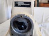 a close up of a white blender on a table