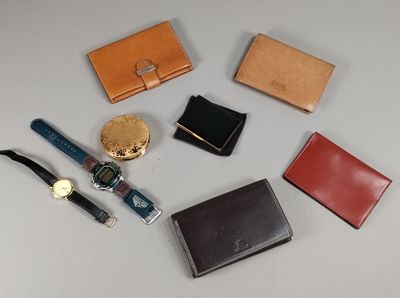 many different types of leather wallets laid out on a table
