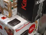 many boxes stacked on top of each other in a store