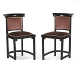 pair of art deco chairs with leather upholstered backrests