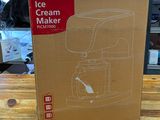 packaging for a ice cream maker on a wooden table in a shop