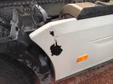 a picture of a white truck with a hole in the front of it