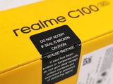 the back of a yellow box with a black label on it