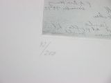 a piece of paper with writing on it sitting on top of a table
