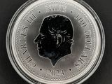 un gros plan d'une pièce de monnaie sur laquelle figure le visage d'un homme