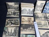 a lot of old postcards that are on the table